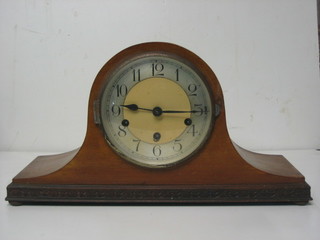 A 1930's chiming mantel clock with silvered dial and Arabic numerals contained in a light mahogany Admiral's hat shaped case
