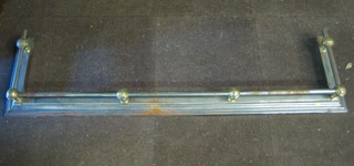 A 19th Century polished steel and brass railed fire curb