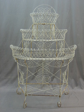 A Victorian crescent shaped wire work 3 tier planter 35"