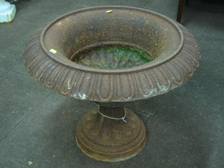 A circular Victorian style cast iron urn 25"