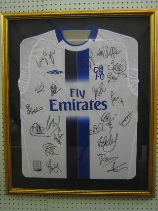 A Chelsea FC white football shirt with Fly Emirates sponsor logo, signed to the front by Bridge, Terry, Sullivan, Hasselbank, Gronkear, Duff, Lampard, Cole, Geremi, Johnson, Cuddiaini, Ranierri, Parker, Petit, Boggard, Gallas, Stanich, Makelele, Crespo, Abbramovich and Gianfranco Zola, complete with certificate of authenticity, framed