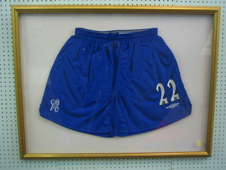 A pair of Chelsea FC blue shorts numbered 22, signed by Gudjohnsen with certificate of authenticity, framed