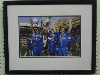 A signed colour photograph of Chelsea Football team signed by Frank Lampard, Peter Cech, Cardoso Tiago, Didier Drogba, holding the Barclays Cup 7" x 11", with certificate of authenticity