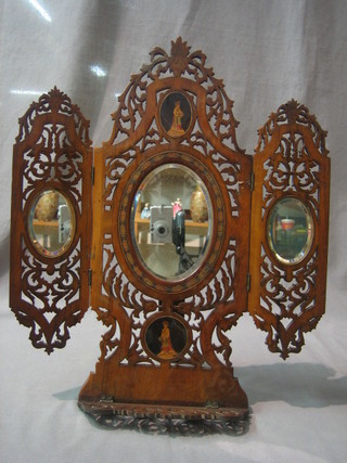 A 19th Century triple plate dressing table mirror contained in a pierced and inlaid olive wood easel frame