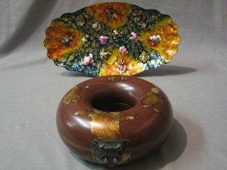 A circular Eastern lacquered box with hinged lid 7" and an oval enamelled dish 12"