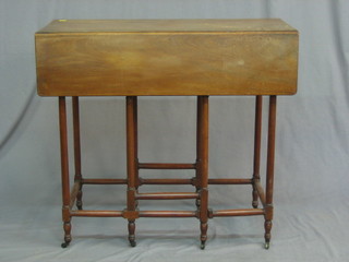 A George III bleached mahogany drop flap Spider's leg table raised on turned and block supports 32"