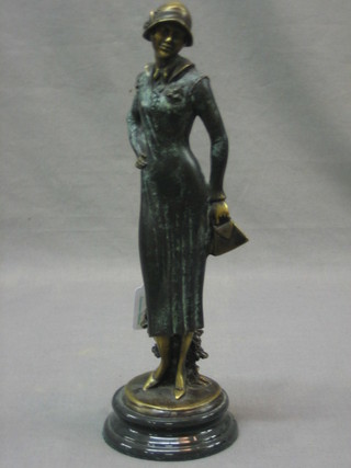 An Art Nouveau style bronze figure of a standing lady 11"