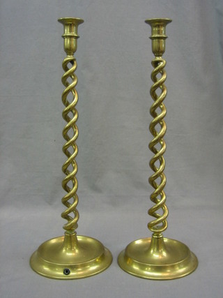 A pair of large brass spiral turned candlesticks 20"