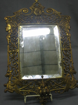 A rectangular bevelled plate wall mirror contained in a pierced brass frame 16"