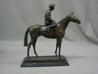 A bronze figure of a race horse with jockey up 13"