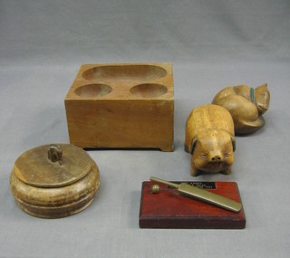 A small wooden cash block, a coat hanger in the form of an eagle and other decorative wooden items