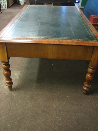 A Victorian mahogany library table with inset tooled black leather top fitted 3 drawers, raised on turned supports 73"