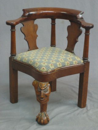 A 19th Century Queen Anne style childs walnut corner chair, raised on cabriole supports