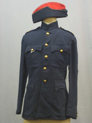 A Royal Artillery Officer's blue patrol tunic by J G Plumb of Westminster together with a side cap, pair of pantaloons and a pair of overalls