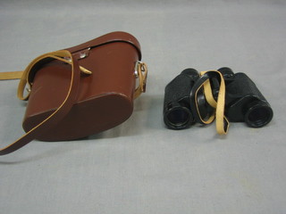 A pair of Weiss 8 x 30 field glasses with leather carrying case