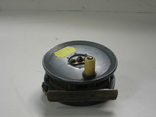 A reproduction centre pin fishing reel marked Wesley Richards 3"