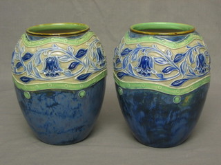 A pair of Royal Doulton Art Nouveau blue salt glazed vases, the bases with impressed Doulton mark, marked 81 40,  8"  (bases with slight firing mark)