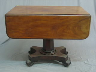 A William IV mahogany pedestal Pembroke table, fitted a drawer and raised on a chamfered column with triform base 36"