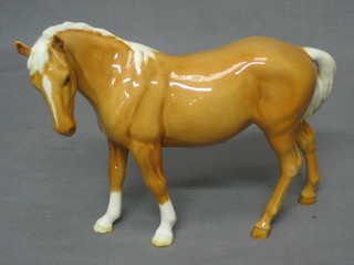 A Beswick figure of a standing Palomino horse 6"
