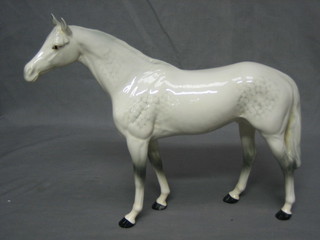 A Beswick figure of a standing dapple grey horse, 11"
