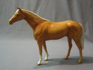 A Beswick figure of a standing Palomino horse 11"