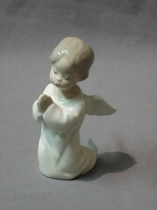 A Lladro figure of a kneeling angel in prayer 5"