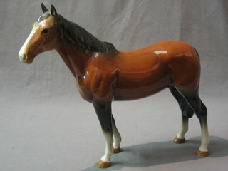 A Melrose pottery figure of a standing horse 11"