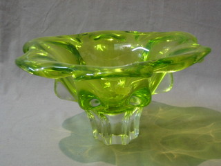 A circular green Art Glass bowl