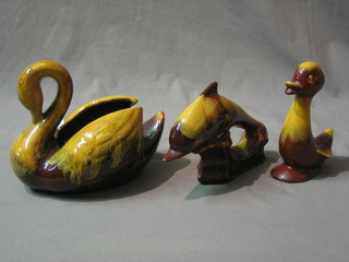 A Canadian Blue Mountain  pottery planter in the form of a swan 6", a figure of a bird 6" and a figure of a dolphin 6"