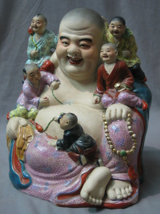 A pottery figure of a seated Buddah 12"