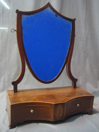 A  19th Century Sheraton style shield shaped dressing table mirror in a mahogany frame, the base of serpentine outline fitted 2 drawers, raised on bracket feet 17"