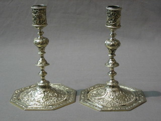 A pair of pierced Eastern silver plated candlesticks, raised on octagonal bases 6 1/2"