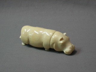 A carved ivory figure of a walking Hippopotamus 5"