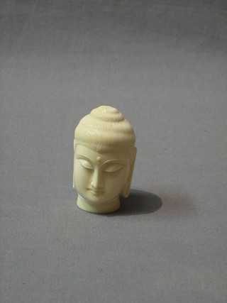 A carved ivory portrait bust of Buddah 3"