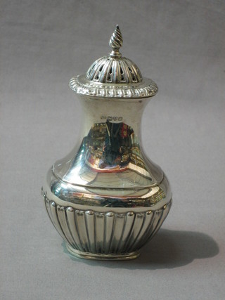 An Edwardian Georgian style silver sugar sifter with demi-reeded decoration, Chester 1901, 5 ozs