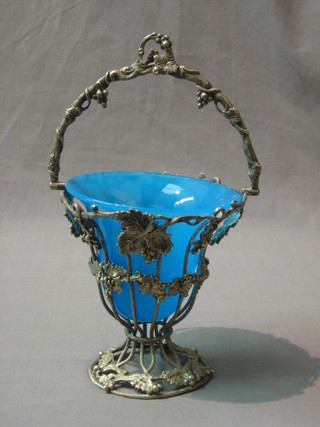A 19th/20th Century silver plated sugar bowl with cast vinery decoration and blue glass liner 5"