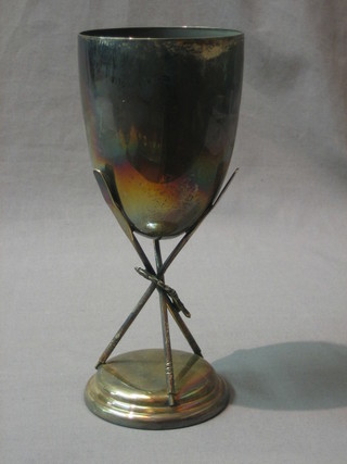 A silver goblet shaped rowing trophy supported by 3 oars 9"