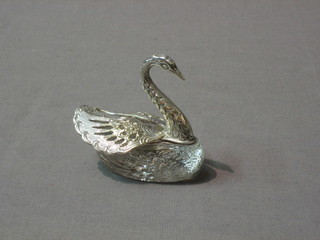 A cut glass salt in the form of a swan with white metal mounts