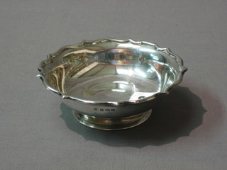 A circular silver pedestal bowl with wavy, Birmingham 1935, 4 1/2", 2 ozs