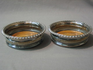 2 Georgian style circular silver plated bottle coasters
