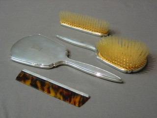 A modern silver backed 4 piece dressing table set with hair brush, clothes brush, comb and hand mirror, hall marked Birmingham