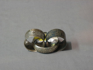 An engraved silver bracelet, a silver napkin ring and 1 other