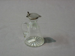 A circular waisted cut glass whisky tot with silver collar, Birmingham 1921