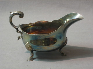 A large silver plated Georgian style sauce boat with C scroll handle