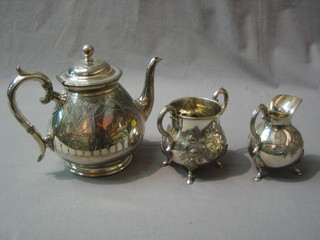 A matched 3 piece engraved Britannia metal tea service comprising teapot, sugar bowl and milk jug