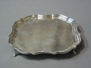A square silver plated bowl with bracketed border, raised on hoof feet, 8"