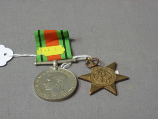 A British War medal to 267140 Pte. R E Frith Royal Sussex Regt. (suspension bar f) together with a 1939-45 Star and a Defence medal (3)