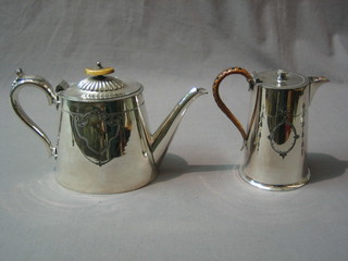 An oval Britannia metal teapot and a matching hotwater jug