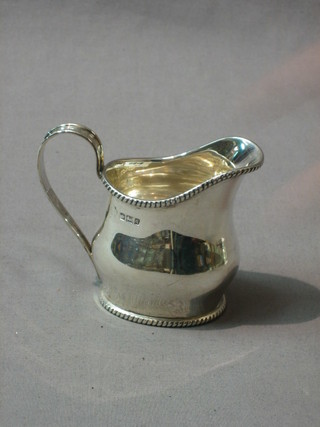 A Georgian style silver cream jug with rope edge border, Sheffield 1908, 3 ozs 