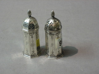 A pair of Victorian octagonal engraved silver pepperettes, Birmingham 1892, 2 ozs